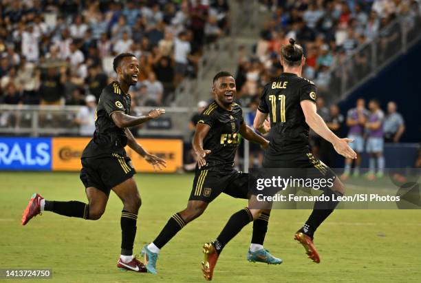 Kellyn Acosta and Diego Palacios run after Gareth Bale of Los Angeles Football Club to celebrate Bales goal during a game between Los Angeles FC and...