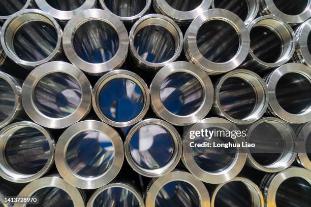 metal pipe fittings during machining - nut fastener stock-fotos und bilder