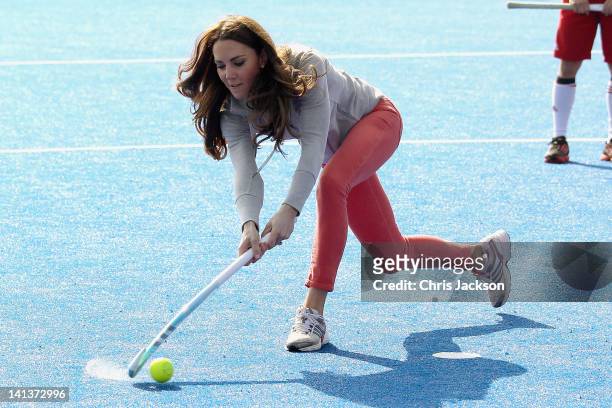 Catherine, Duchess of Cambridge plays hockey with the GB hockey teams at the Riverside Arena in the Olympic Park on March 15, 2012 in London,...