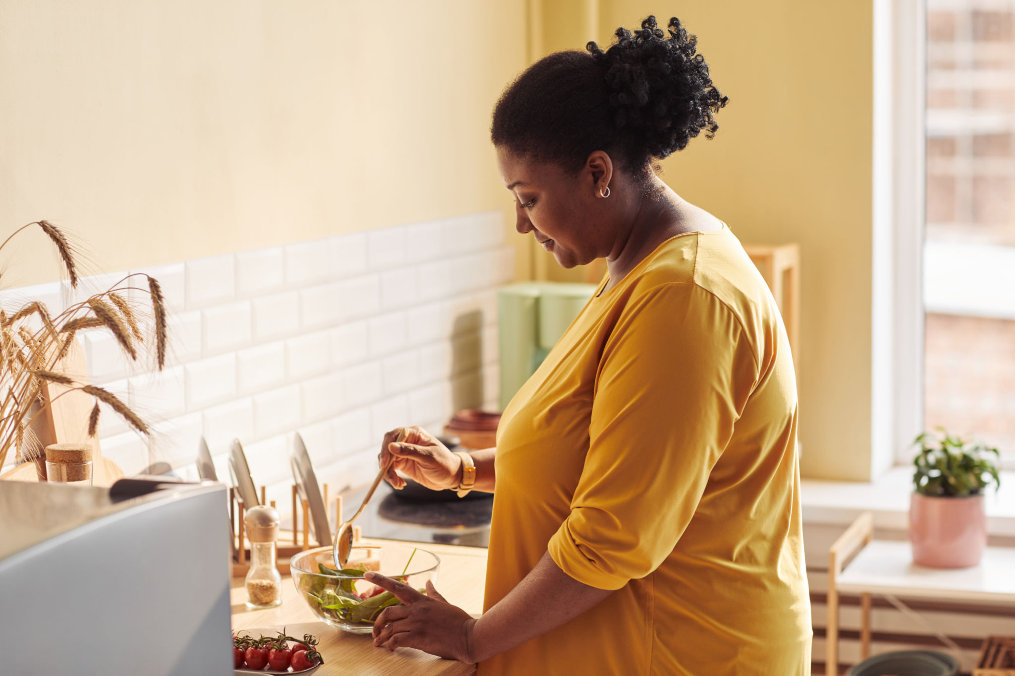 Black Woman Cooking in Cozy Kitchen Black Woman Cooking in Cozy Kitchen