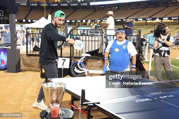 Cody Bellinger and Guillermo Rodriguez attend Ping Pong 4 Purpose at Dodger Stadium presented by Skechers and UCLA Health on August 08, 2022 in Los...