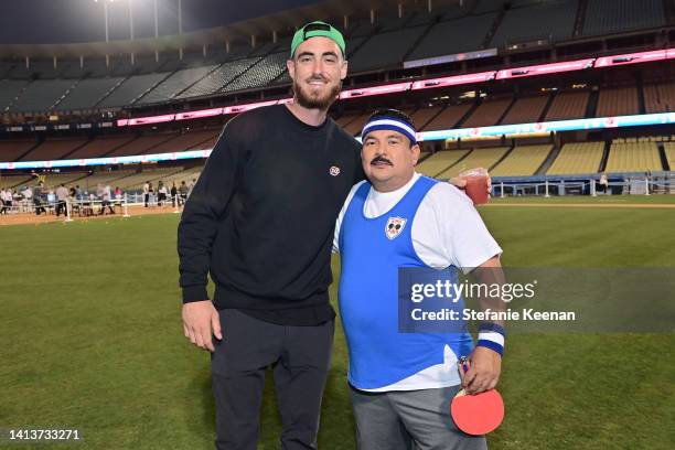 Cody Bellinger and Guillermo Rodriguez attend Ping Pong 4 Purpose at Dodger Stadium presented by Skechers and UCLA Health on August 08, 2022 in Los...