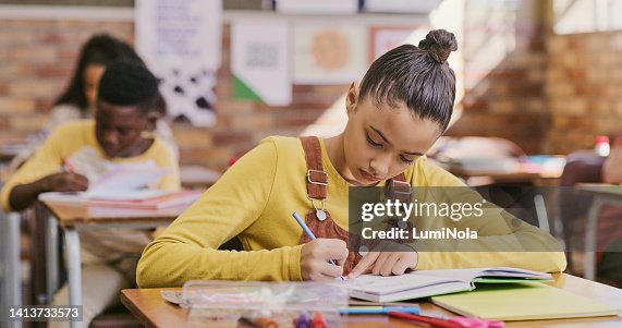 Girl Writing Assignment Girl Student Or Child Writing In A Book And Completing An Exam Project ...