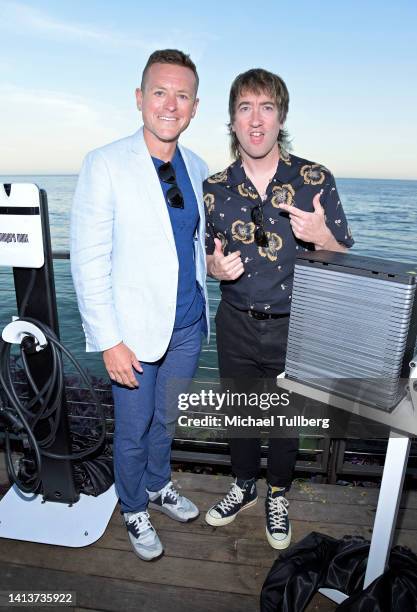 Ed Syster and musician Tom Higgenson attend the private unveiling of the Meyers Manx electric automobile at Little Beach House Malibu on August 08,...