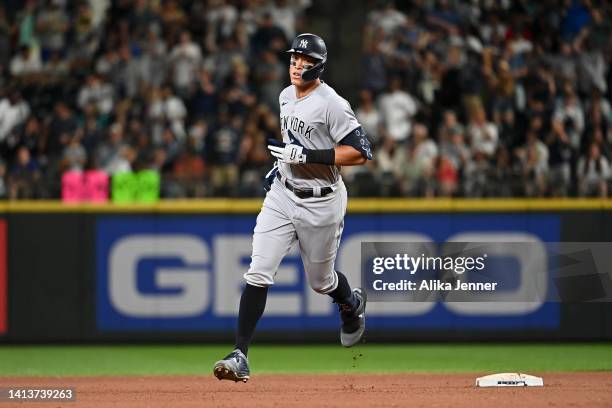 Aaron Judge of the New York Yankees rounds second base after hitting a solo home run during the ninth inning against the Seattle Mariners at T-Mobile...