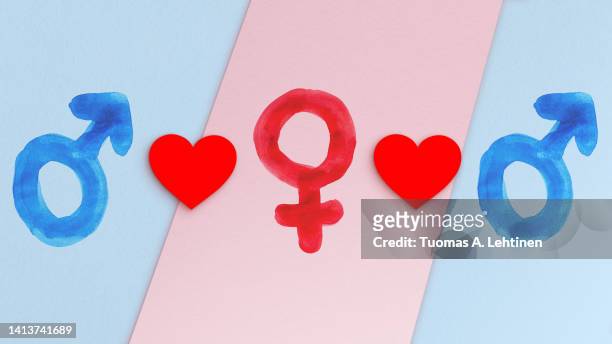 polyamory concept. two blue male gender symbols, one red female gender symbol and hearts. - polygamy ストックフォトと画像