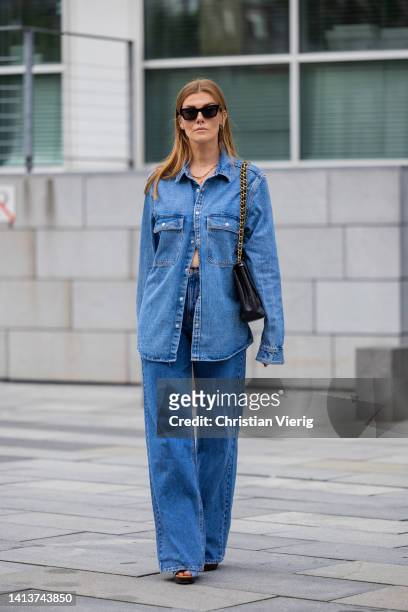 Cati Schweyer is seen wearing Sunglasses Bottega Veneta, denim button shirt zara, flared pants Pull & Bear, Shoes seebychloe, Bag Chanel on August...