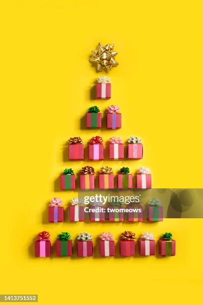 flat lay conceptual christmas tree form by gift boxes still life. - gift box top stock pictures, royalty-free photos & images