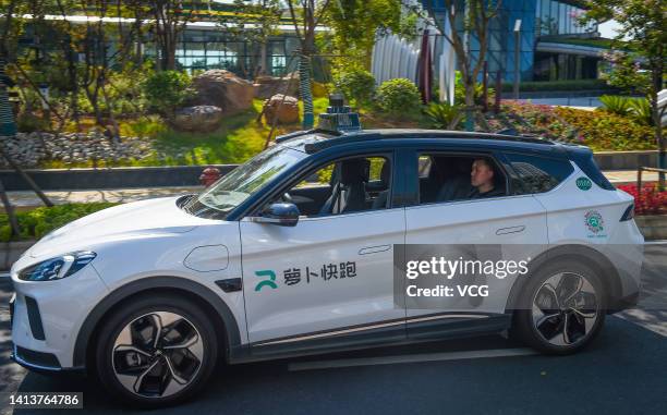 Baidu's Apollo Go self-driving taxi moves along a road on August 8, 2022 in Wuhan, Hubei Province of China. Baidu's Apollo Go was authorized to...