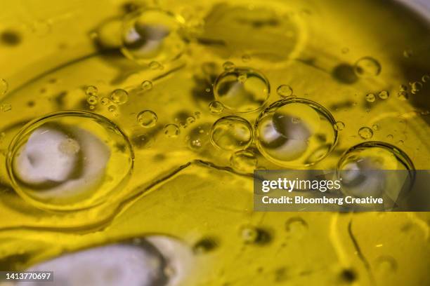 abstract olive oil and water bubbles - olive oil photos et images de collection