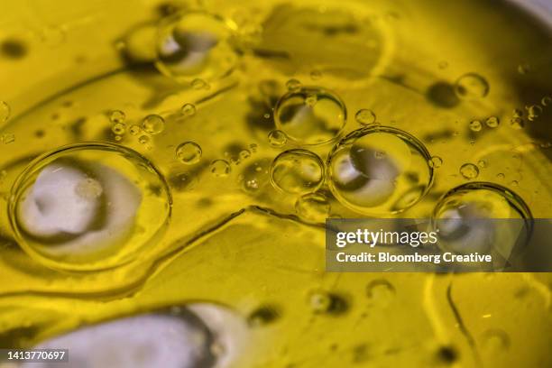 abstract olive oil and water bubbles - olive oil ストックフォトと画像