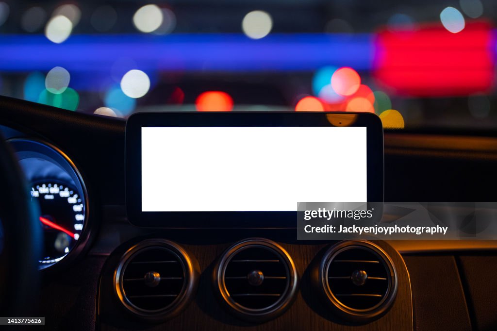 A digital display screen on the dashboard of a modern car