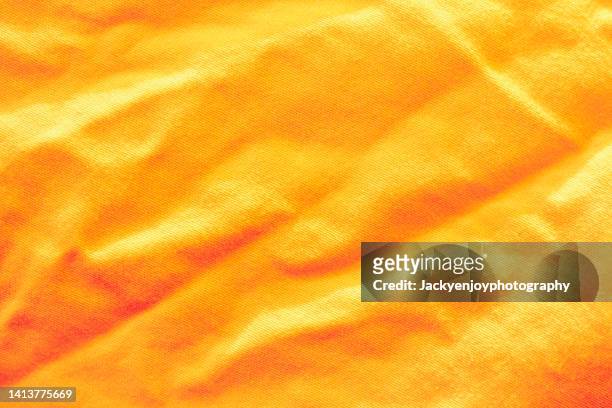 yellow-orange fabric texture background. - towel texture stock pictures, royalty-free photos & images