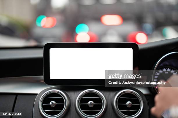 a digital display screen on the dashboard of a modern car - gps stock-fotos und bilder