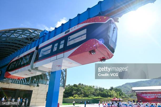 China's first permanent maglev-suspension monorail, Xingguo, runs along an 800-meter-long elevated single track during a trial run on August 9, 2022...