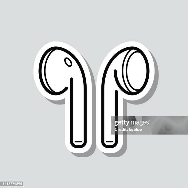 kabellose ohrhörer. symbolaufkleber auf grauem hintergrund - in ear headphones stock-grafiken, -clipart, -cartoons und -symbole