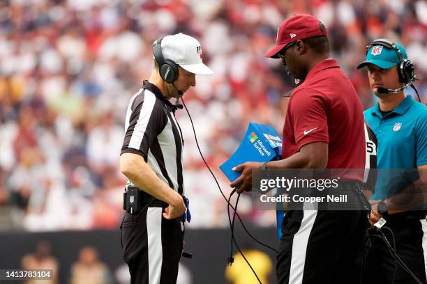 Referee looks at a replay on a Microsoft Surface tablet during an NFL football game between the Houston Texans and Jacksonville Jaguars, Sunday,...