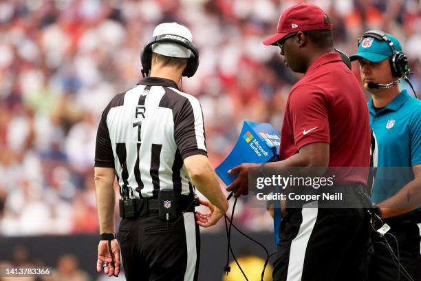 Referee looks at a replay on a Microsoft Surface tablet during an NFL football game between the Houston Texans and Jacksonville Jaguars, Sunday,...