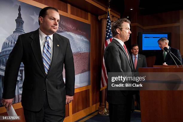 From left, Sen. Mike Lee, R-Utah, Sen. Rand Paul, R-Ky., Sen. Jim DeMint, R-S.C., and Sen. Lindsey Graham, R-S.C. Gather to hold a news conference in...