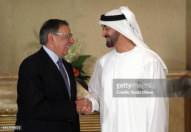 United States Secretary of Defense Leon Panetta poses for a photo with Crown Prince of Abu Dhabi Mohamed bin Zayed Al Nahyan before the two sat for...