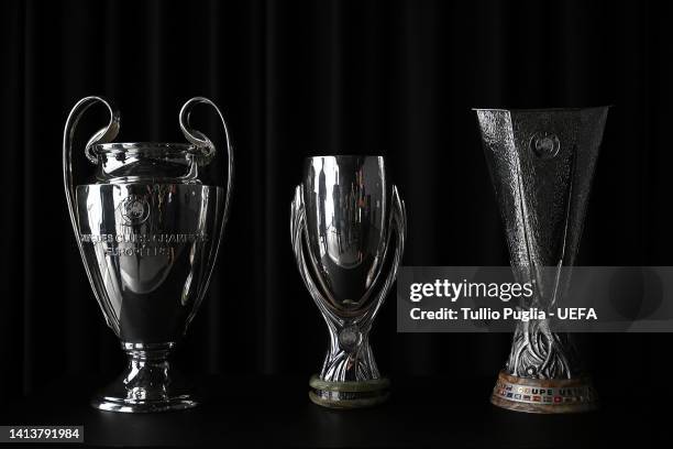 Champions league, Super Cup and UEFA Europa league trophies are displayed at the Fan Village ahead of the UEFA Super Cup Final 2022 on August 09,...