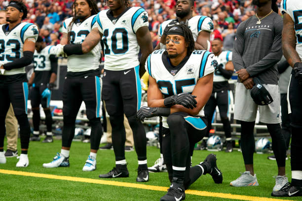 Eric Reid of the Carolina Panthers kneels during the National Anthem before an NFL football game against the Houston Texans Sunday, Sept. 29 in...
