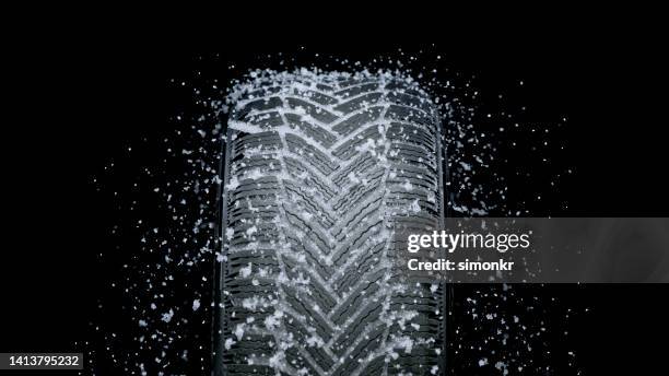 ice splashing on tyre - tyre stock pictures, royalty-free photos & images