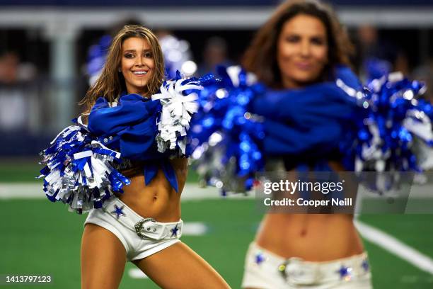 The Dallas Cowboys Cheerleaders perform during an NFL football game against the Philadelphia Eagles, Sunday, Oct. 6 in Arlington, Texas.