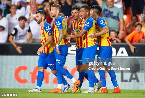 Hugo Duro of Valencia CF celebrates after scoring their side's first goal with his teammates during the 50th Edition of Trofeu Taronja match between...