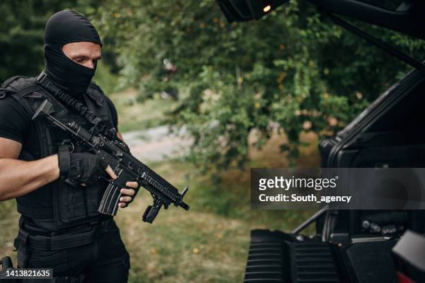 swat team soldier is ready for a mission - balaclava gun stock pictures, royalty-free photos & images