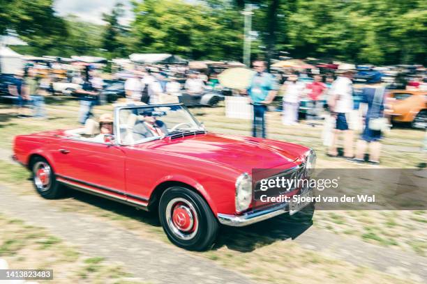 Mercedes-Benz 280SL convertible classic car performing a demonstration drive during the classic days event on August 6, 2022 in Düsseldorf, Germany....