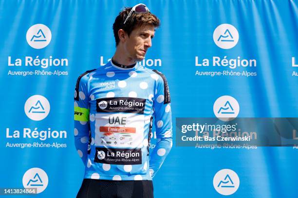 George Bennett of New Zealand and UAE Team Emirates celebrates winning the Polka Dot Mountain Jersey on the podium ceremony after the 34th Tour de...