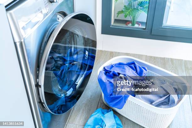 laundry: modern washing machine and laundry basket - laundry basket imagens e fotografias de stock