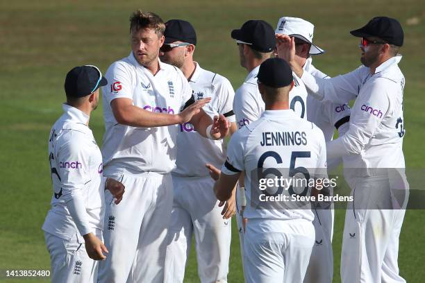 Ollie Robinson of England Lions celebrates taking the wicket, clean bowled of Rassie van der Dussen of South Africa with his team mates during the...