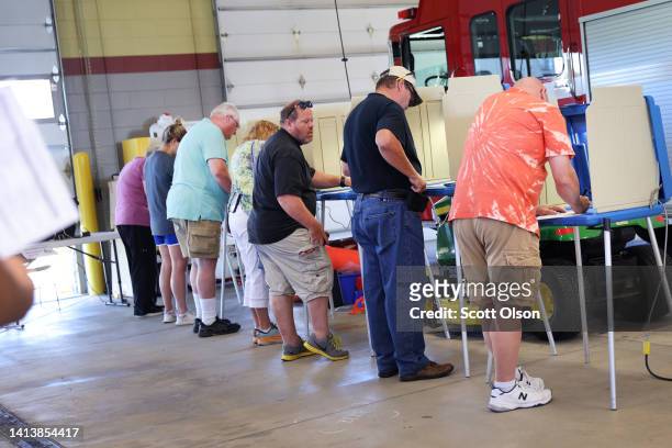 Voters cast their ballots at a polling place at the Western Lakes fire station on August 09, 2022 in Oconomowoc, Wisconsin. Wisconsin is holding its...