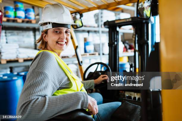 woman on forklift in warehouse depot - female driving stock pictures, royalty-free photos & images