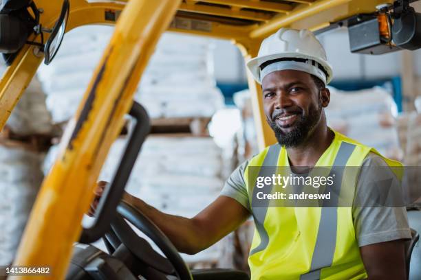 worker on forklift - ware house worker forklift stock pictures, royalty-free photos & images