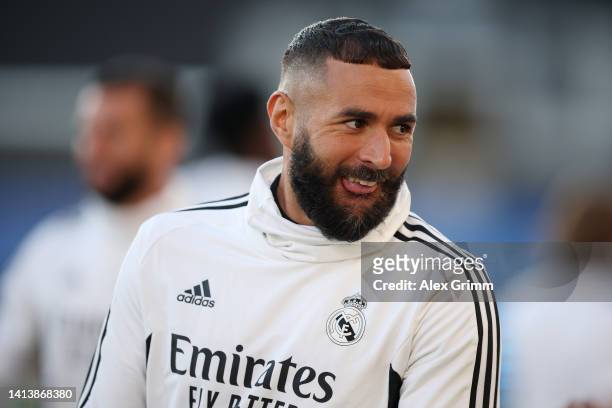 Karim Benzema of Real Madrid reacts during the Real Madrid CF training session and press conference ahead of the UEFA Super Cup Final 2022 at...