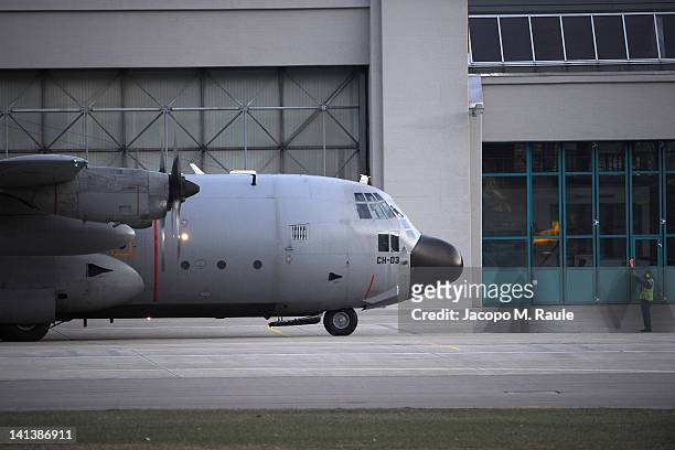 Belgian C-130 military transport plane arrives to collect bodies and the injured after the coach disaster on March 15, 2012 at Sion Airport,...