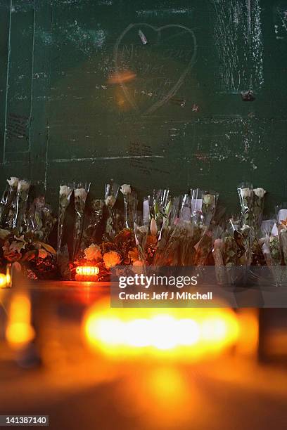 Floral tributes and candles laid by the families at the scene in the road tunnel where the 22 Belgian school children, four teachers and two drivers...