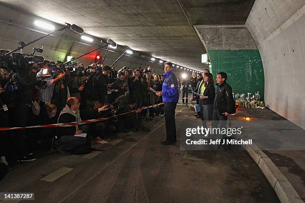 Swiss officials hold a media conference next to the scene in the road tunnel where the 22 Belgian school children, four teachers and two drivers died...