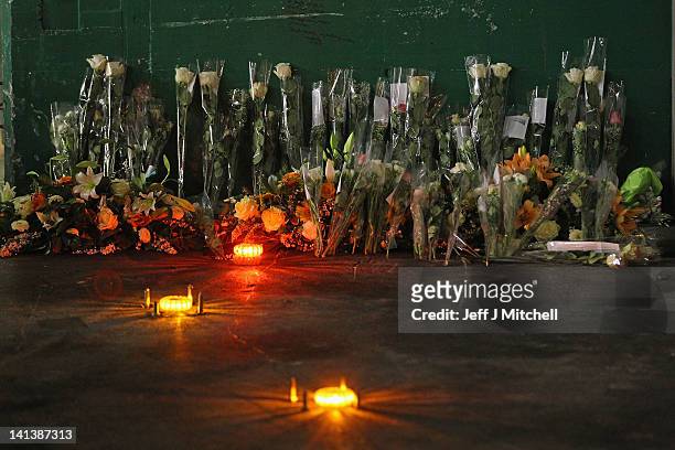 Floral tributes and candles laid by the families at the scene in the road tunnel where the 22 Belgian school children, four teachers and two drivers...