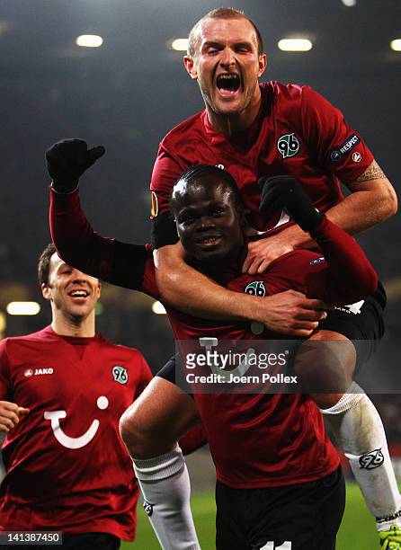 Didier Ya Konan of Hannover celebrates with his team mates after scoring his team's third goal during the UEFA Europa League second leg round of 16...