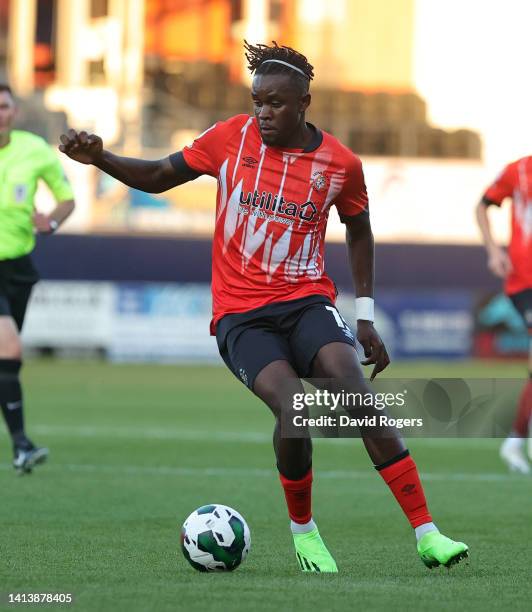 Admiral Muskwe of Luton Town runs with the ball during the Carabao Cup First Round match between Luton Town and Newport County at Kenilworth Road on...