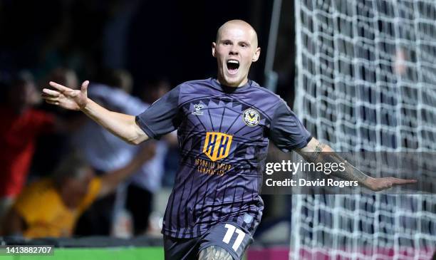 James Waite of Newport County celebrates after scoring their third goal during the Carabao Cup First Round match between Luton Town and Newport...