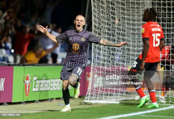 James Waite of Newport County celebrates after scoring their third goal during the Carabao Cup First Round match between Luton Town and Newport...