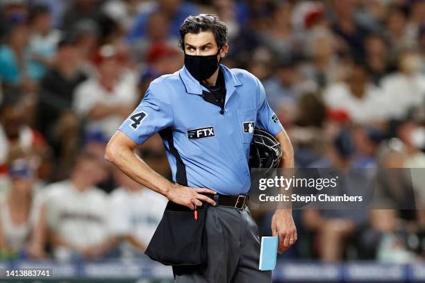 Umpire John Tumpane looks on during the eighth inning between the Seattle Mariners and the Los Angeles Angels at T-Mobile Park on August 06, 2022 in...