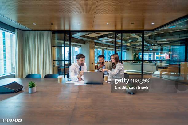 business colleagues in a meeting, or financial advisor or lawyer with couple explaining options. - advice imagens e fotografias de stock