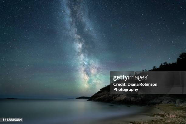 the milky way and airglow over sand beach in acadia national park, maine - acadia national park stock pictures, royalty-free photos & images