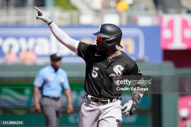 Josh Harrison of the Chicago White Sox celebrates his home run as he runs the bases in the third inning during the first game of a doubleheader...